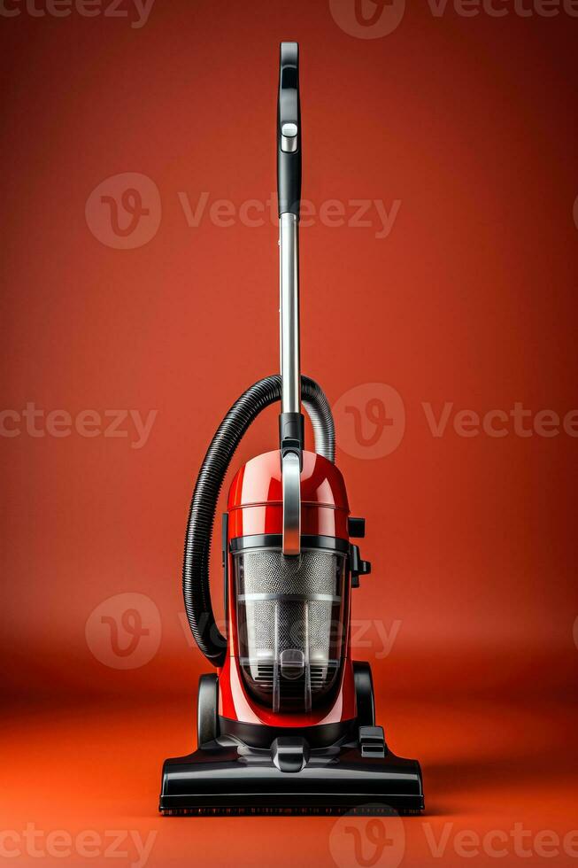 A modern professional vacuum cleaner isolated on a red gradient background photo