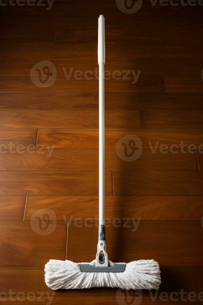 Hardwood floor mop with washable pad isolated on a brown gradient background photo