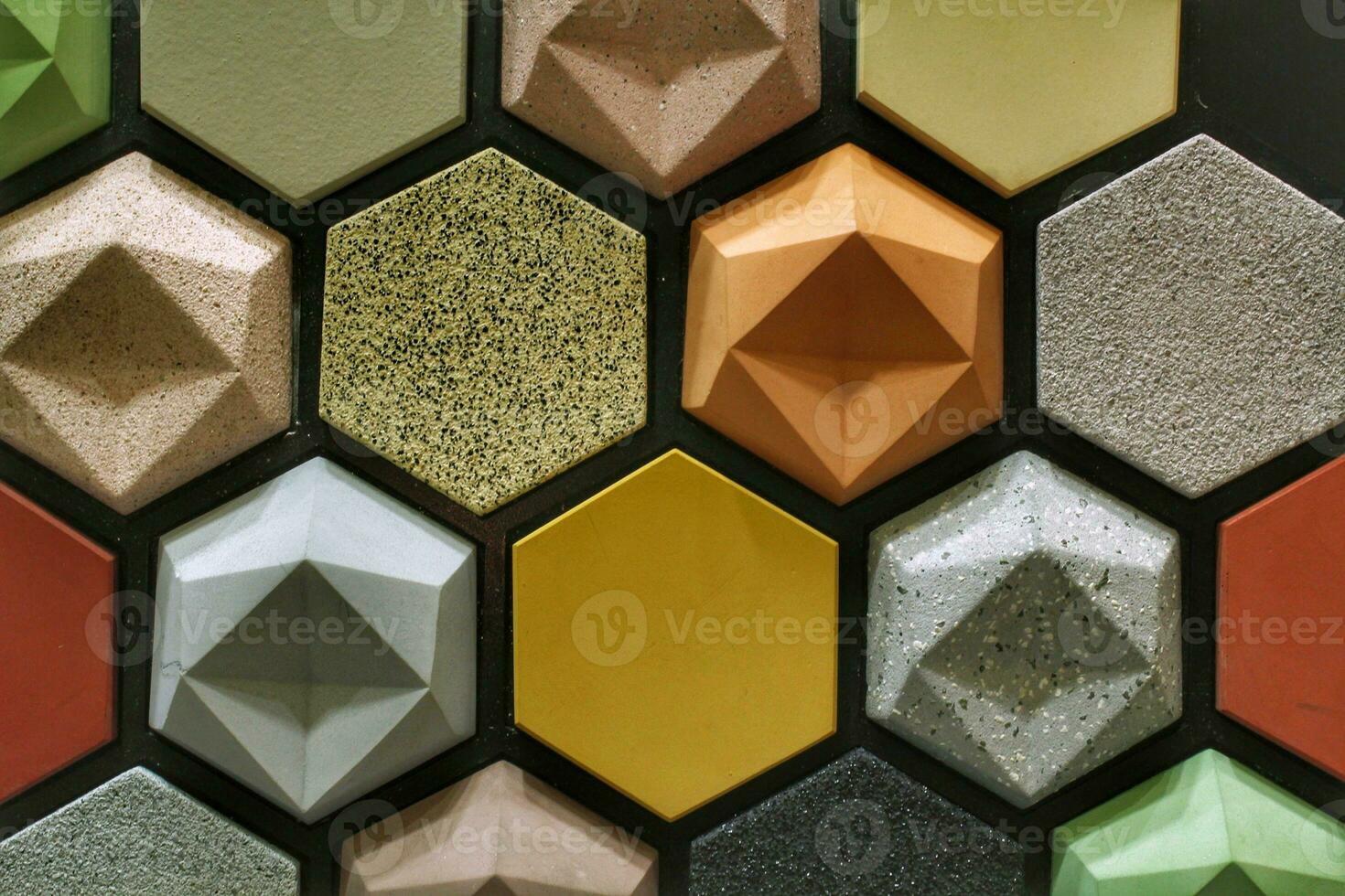Colorful stone wall with hexagon tile pattern. Geometric texture marble wall. Architecture decorative design of home. Showroom detail photo