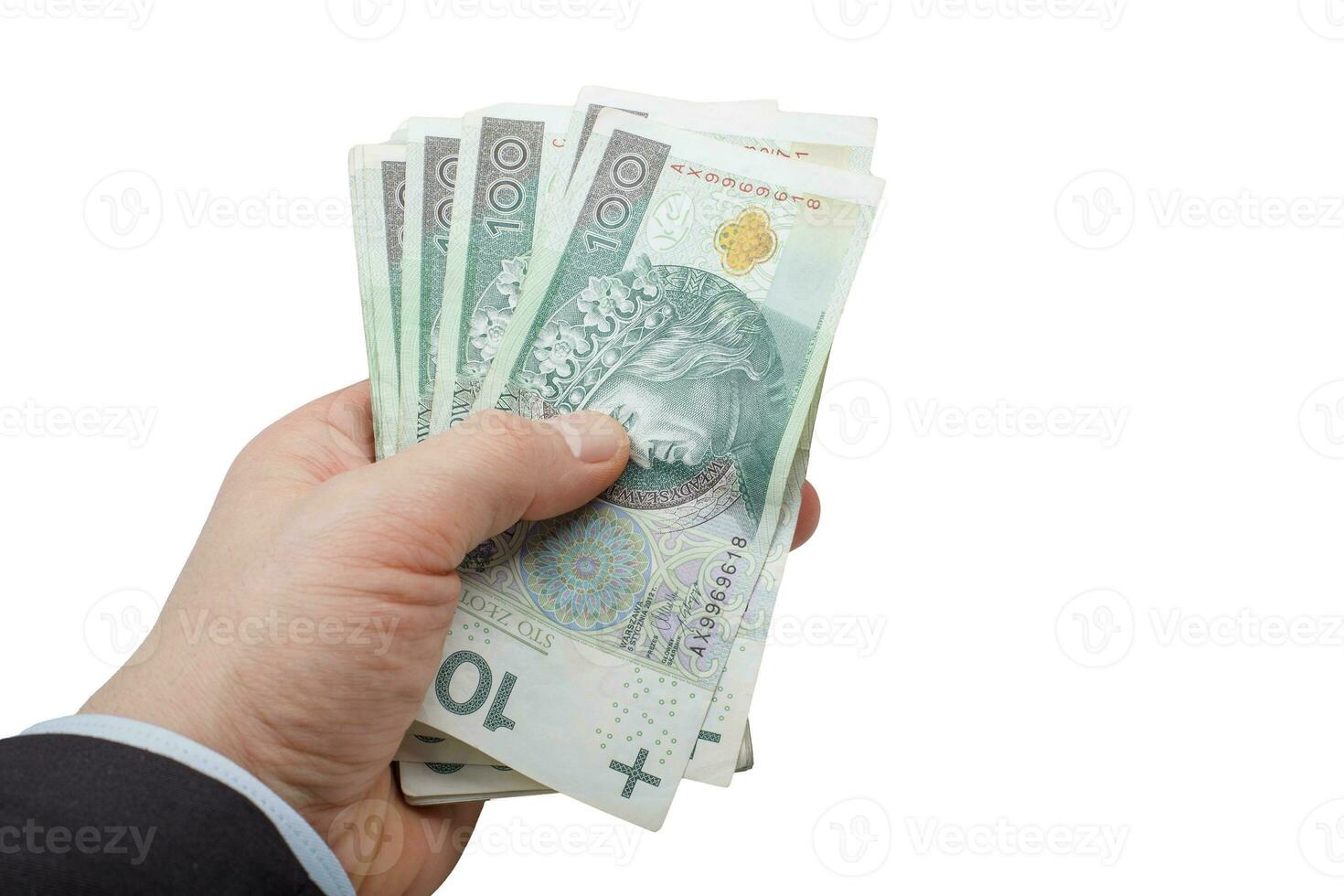 Banker's Hand Holding Polish 100 PLN Banknotes photo