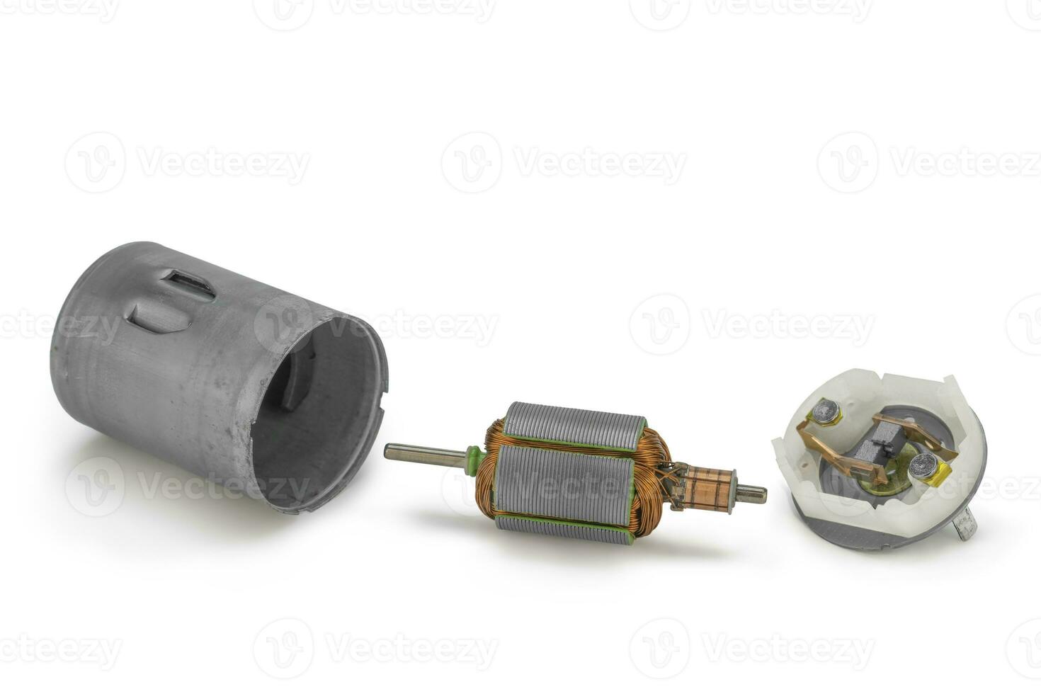 Disassembled dc motor parts on isolated white background photo