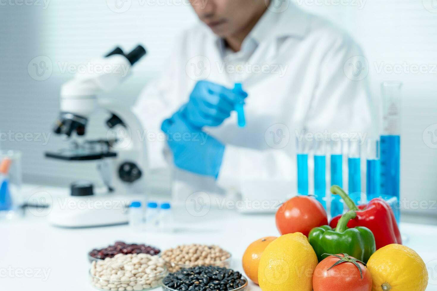 Scientist check chemical food residues in laboratory. Control experts inspect quality of fruits, vegetables. lab, hazards, ROHs, find prohibited substances, contaminate, Microscope, Microbiologist photo