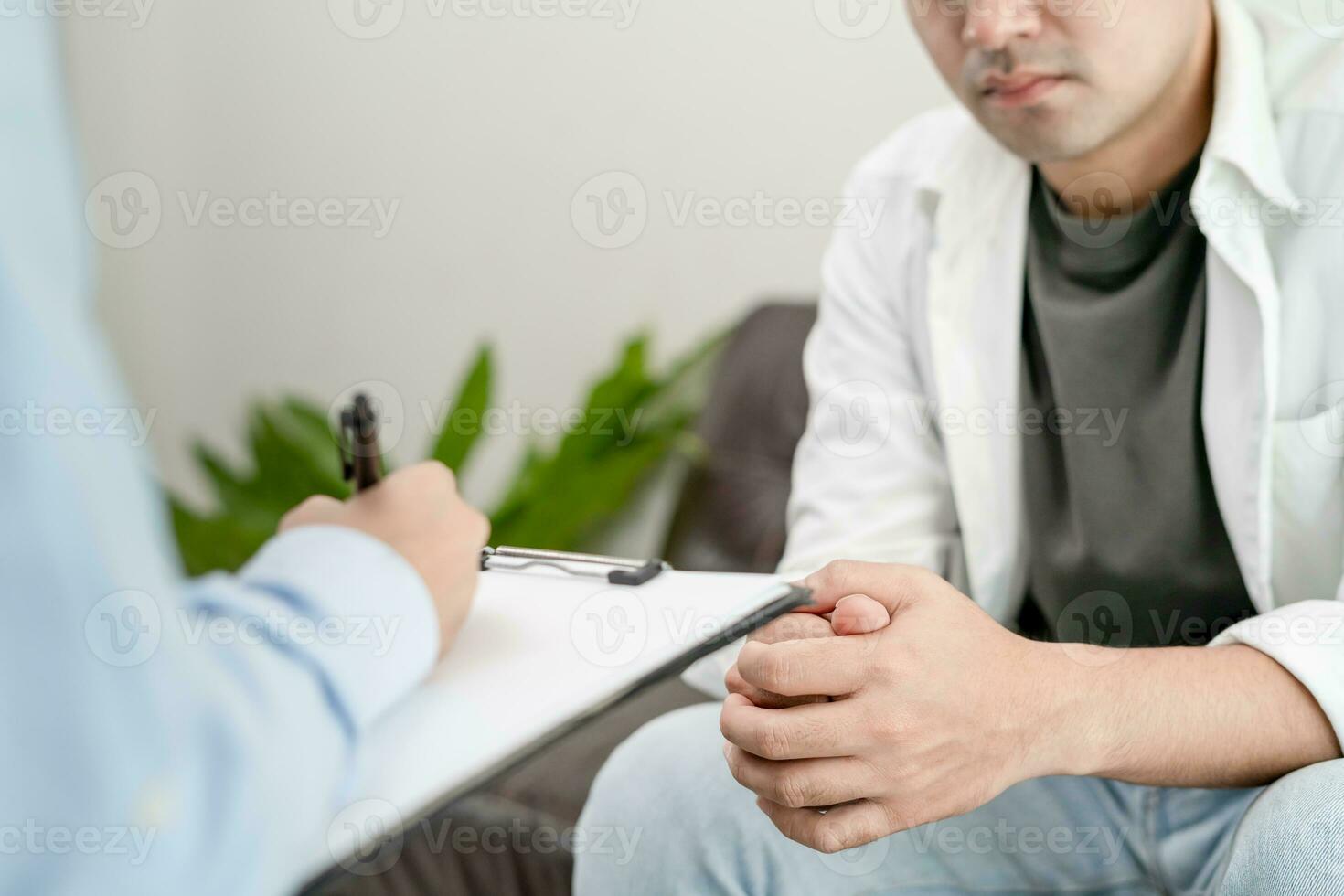 man with mental health problems is consulting. psychiatrist is recording the patient's condition for treatment. encouragement, love and family problem, bipolar , depression patient, protect suicide photo