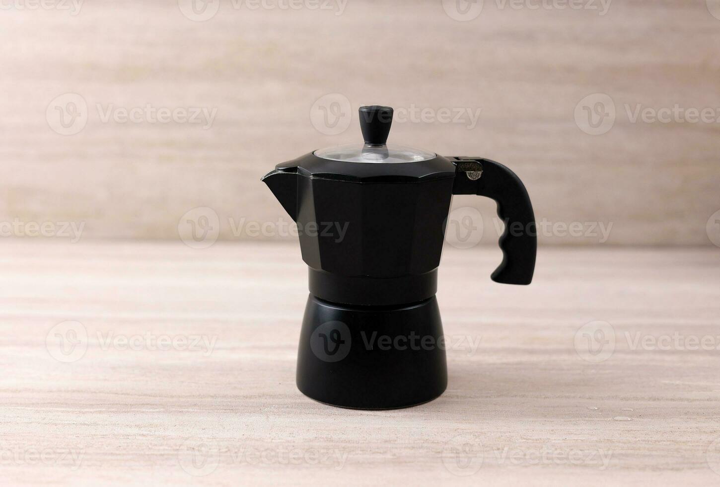 Black Moka Pot on Brown Wooden Table photo