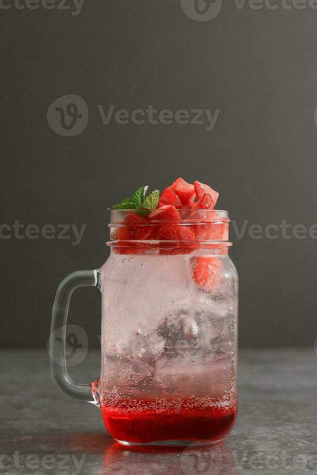 Strawberry Mojito with Soda and Red Syrup in Drink Jar photo