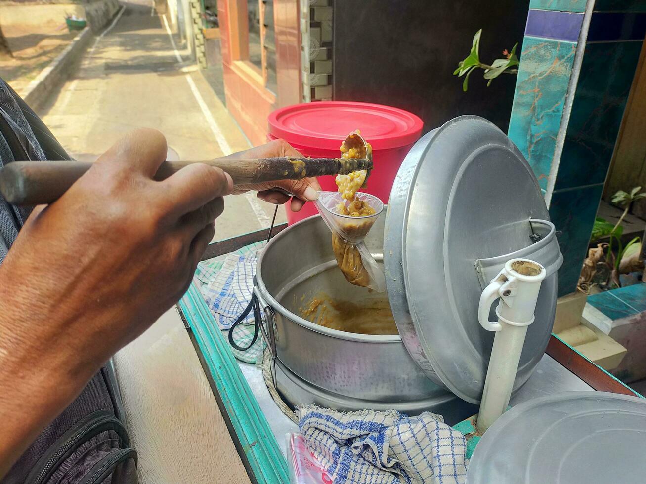 seller of green bean porridge, traveling around using a cart on a stand photo
