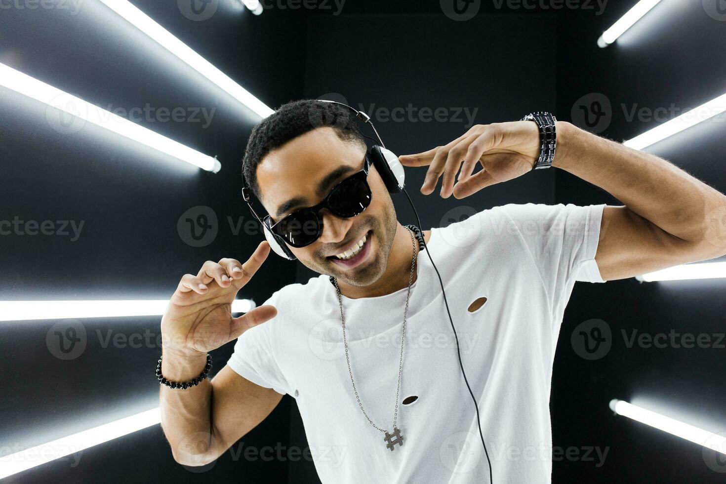 black man dancing in neon lights photo