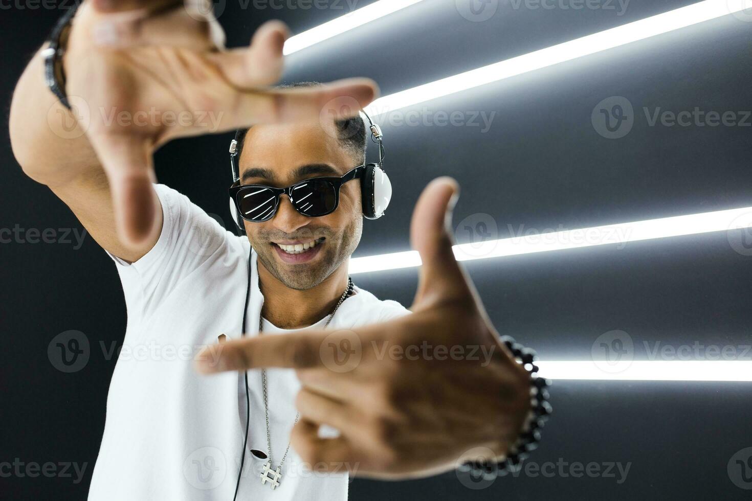 black man dancing in neon lights photo