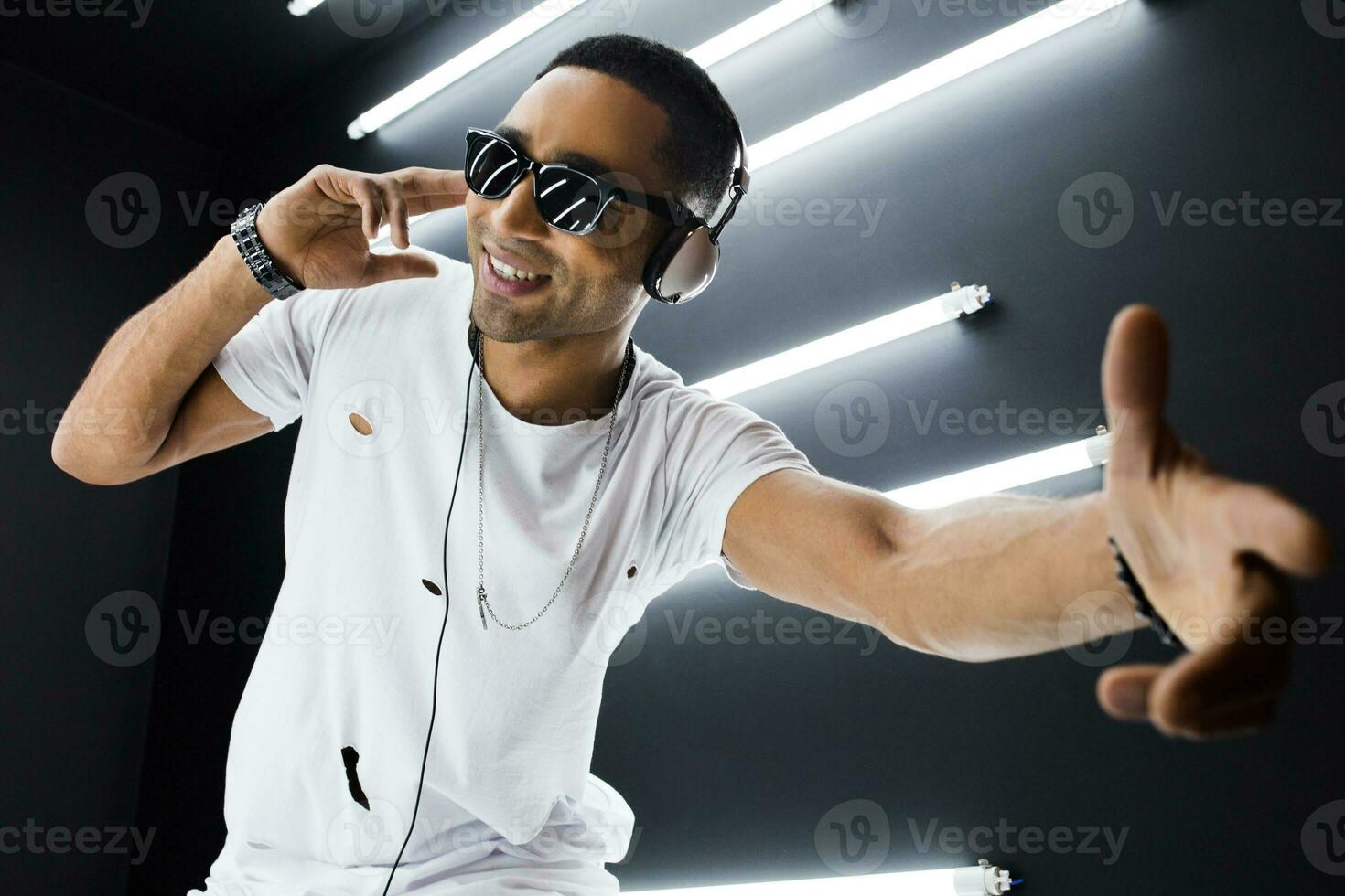 black man dancing in neon lights photo