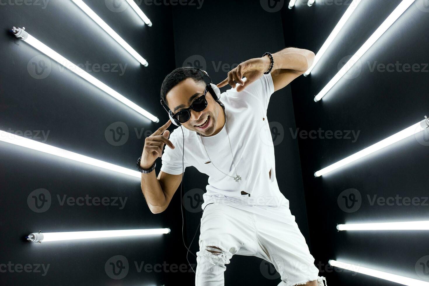 black man dancing in neon lights photo