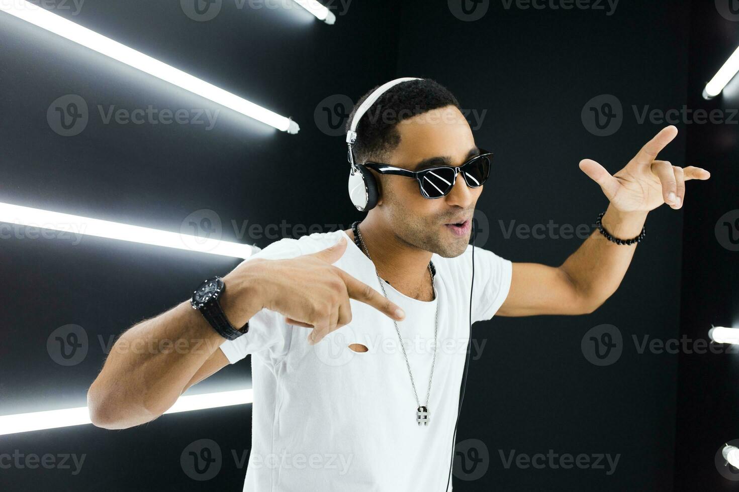 black man dancing in neon lights photo