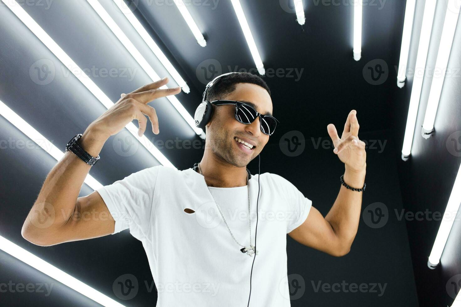 black man dancing in neon lights photo