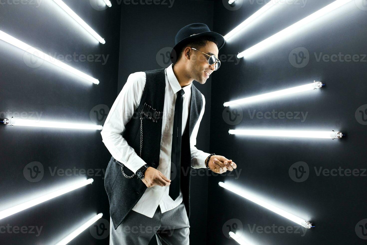 black man dancing in neon lights photo