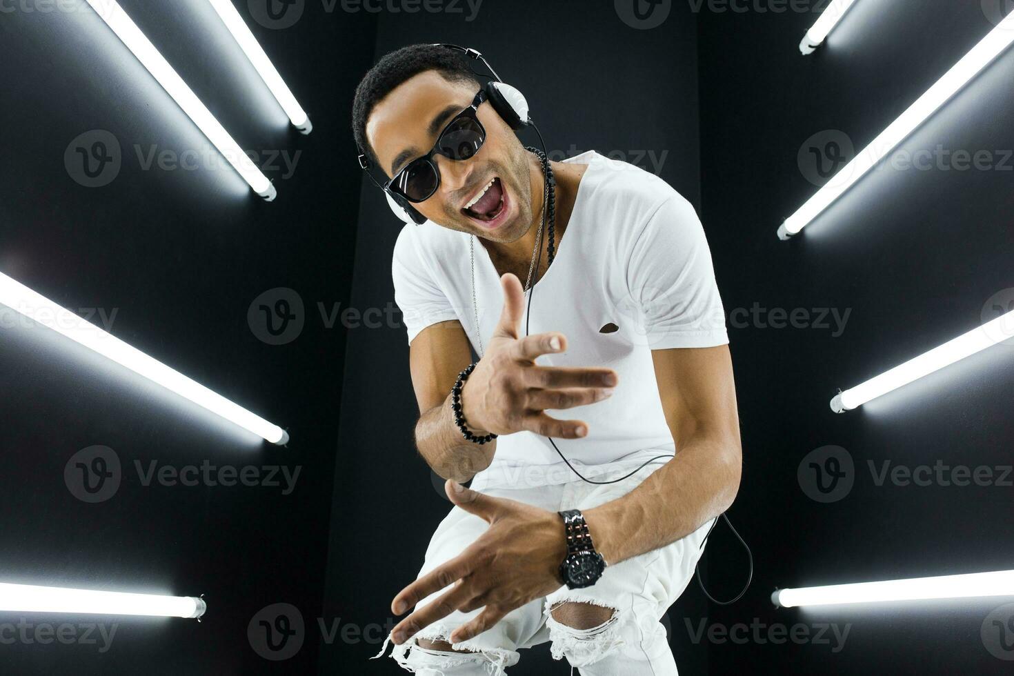 black man dancing in neon lights photo