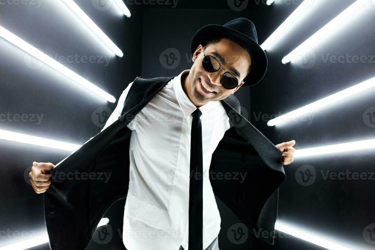 black man dancing in neon lights photo