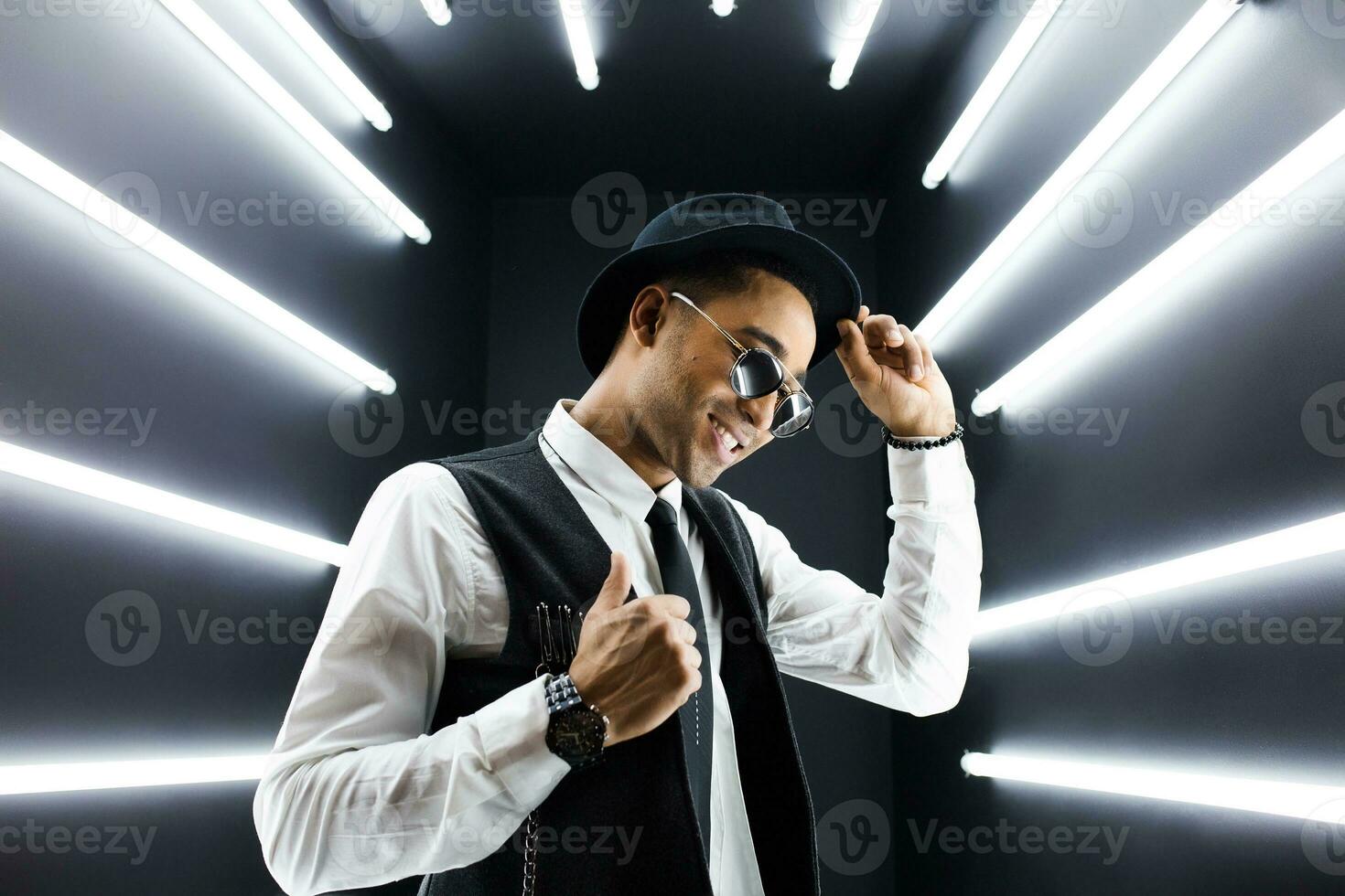 black man dancing in neon lights photo