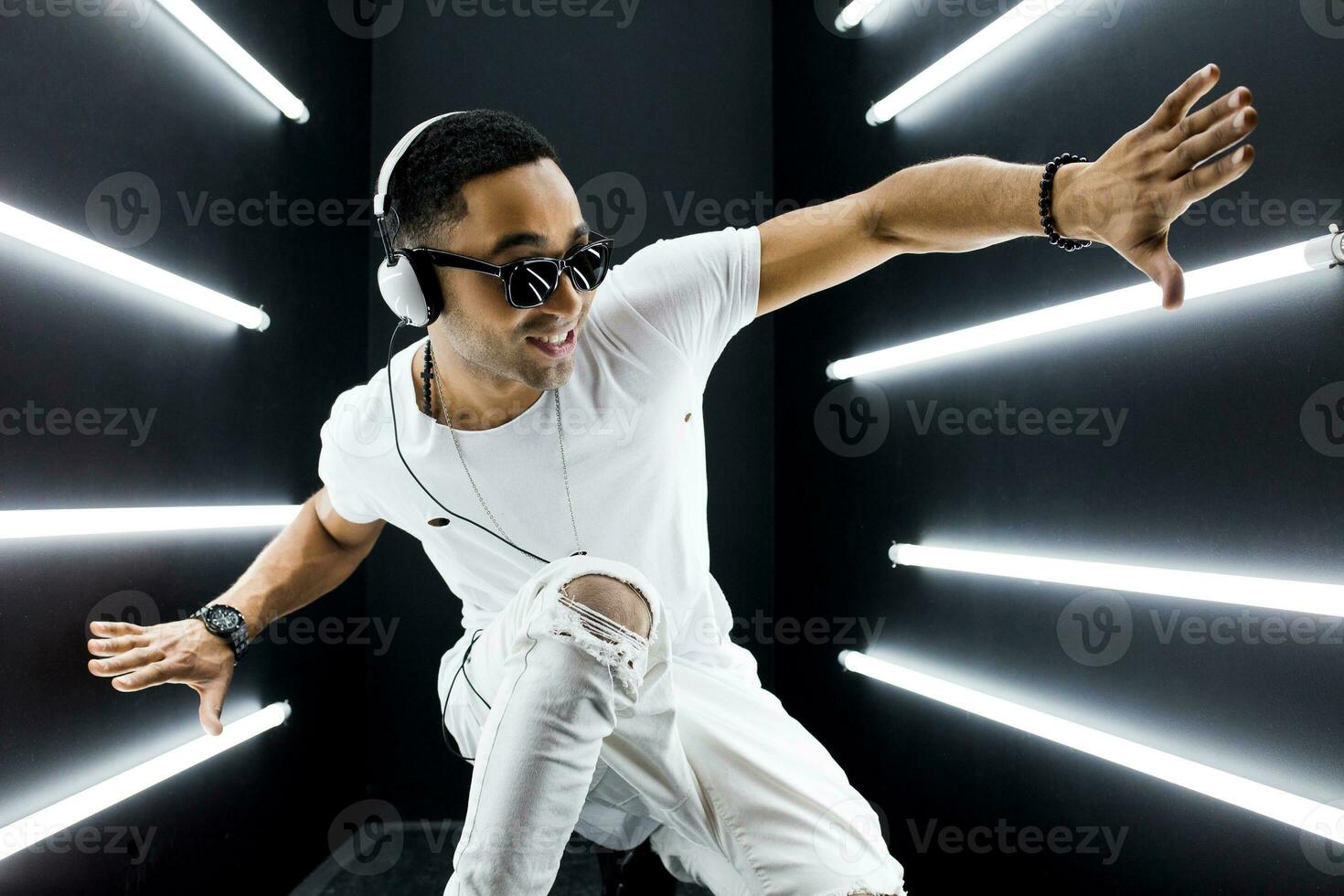 black man dancing in neon lights photo