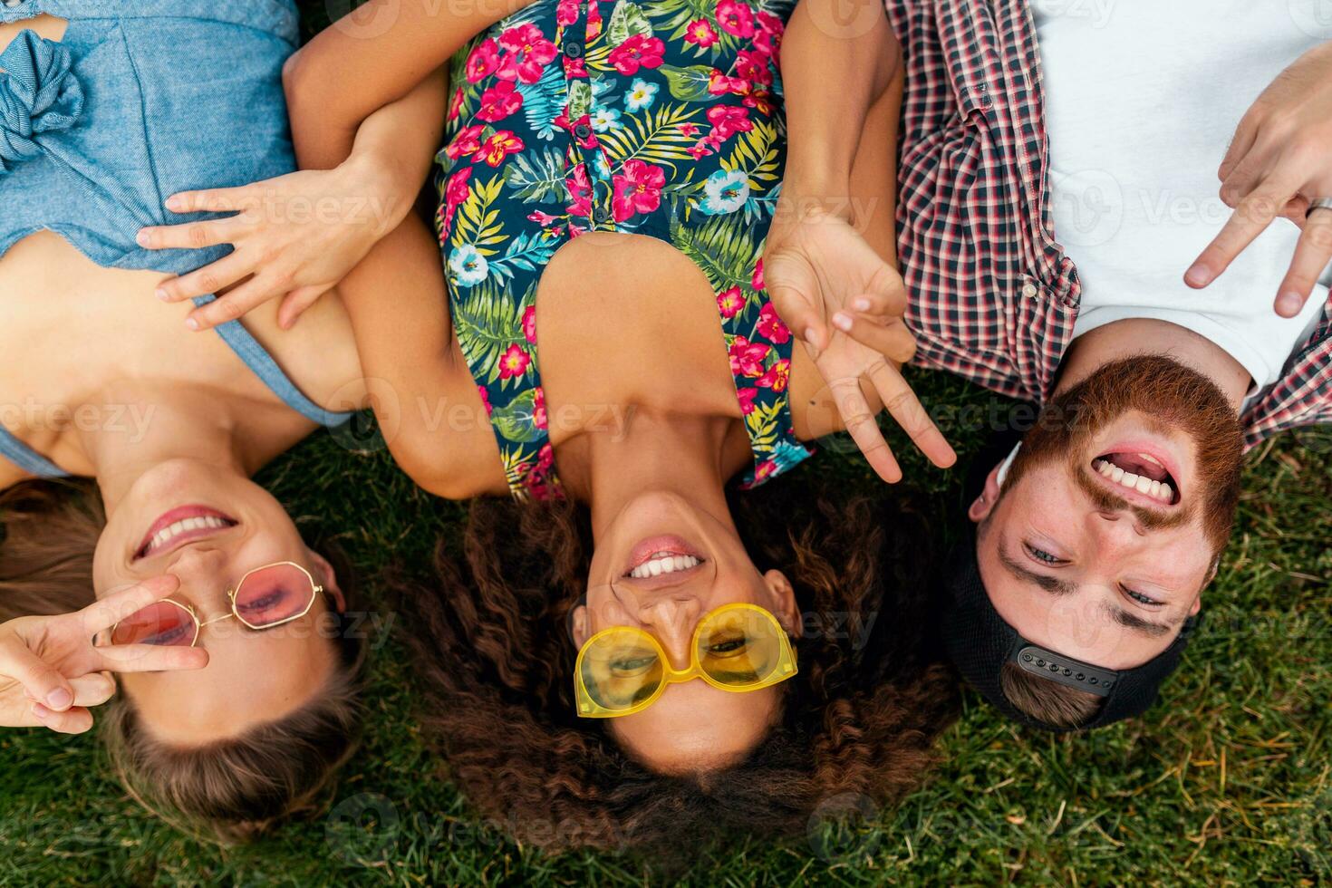 happy young company of friends sitting park photo