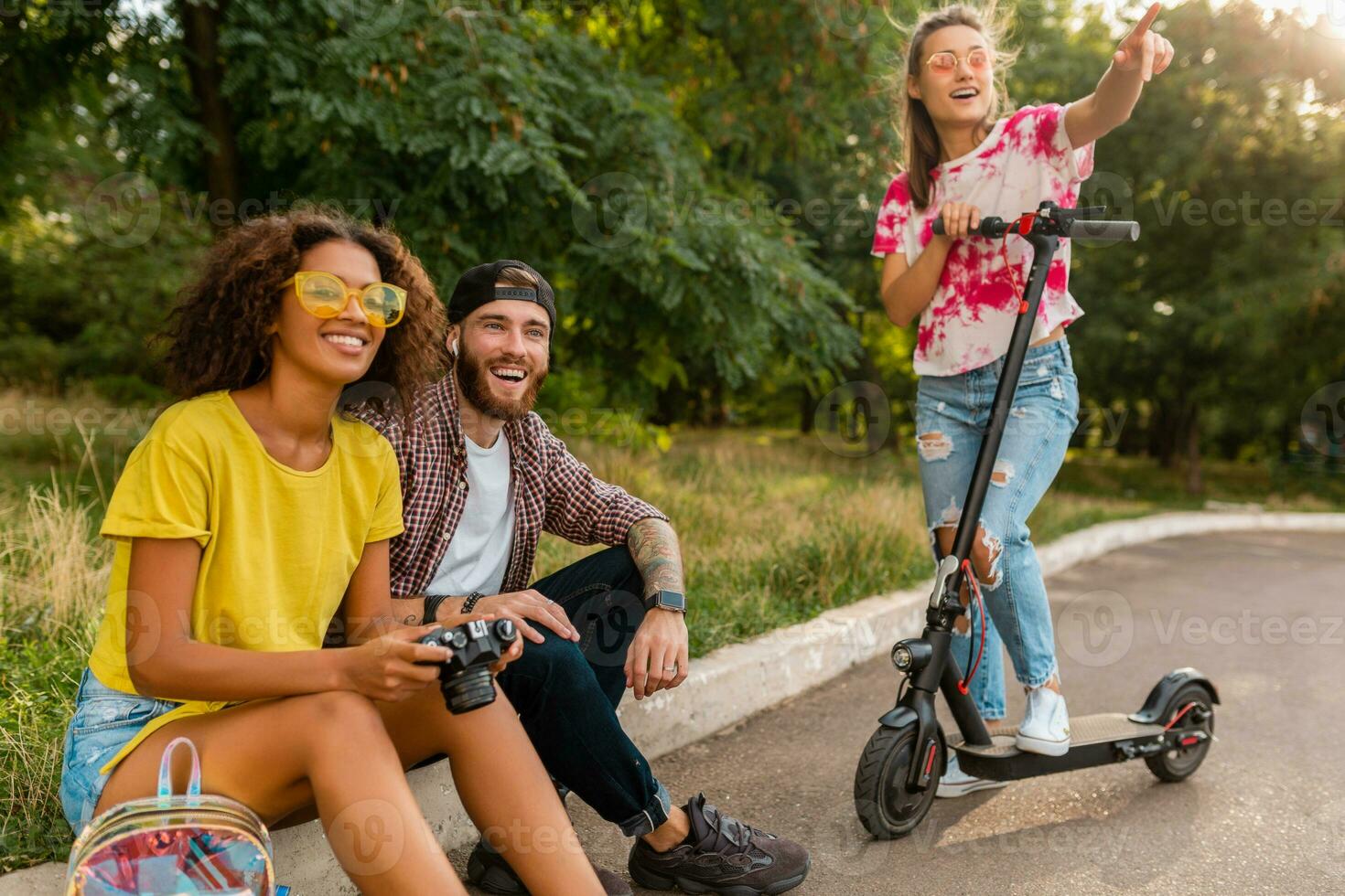 happy young company of friends having fun in park photo