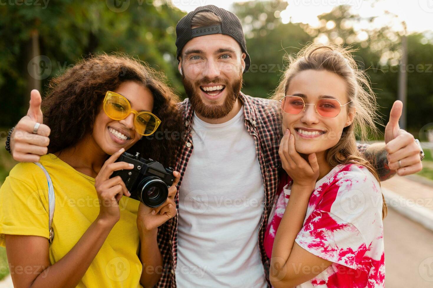 happy young company of friends having fun in park photo