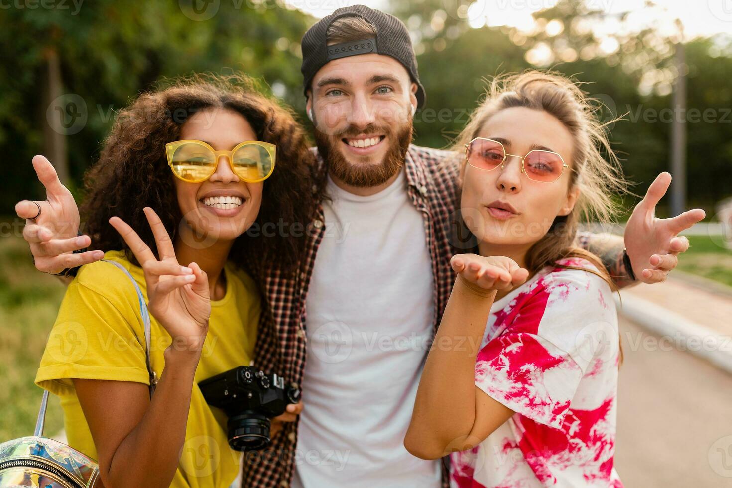 happy young company of friends having fun in park photo