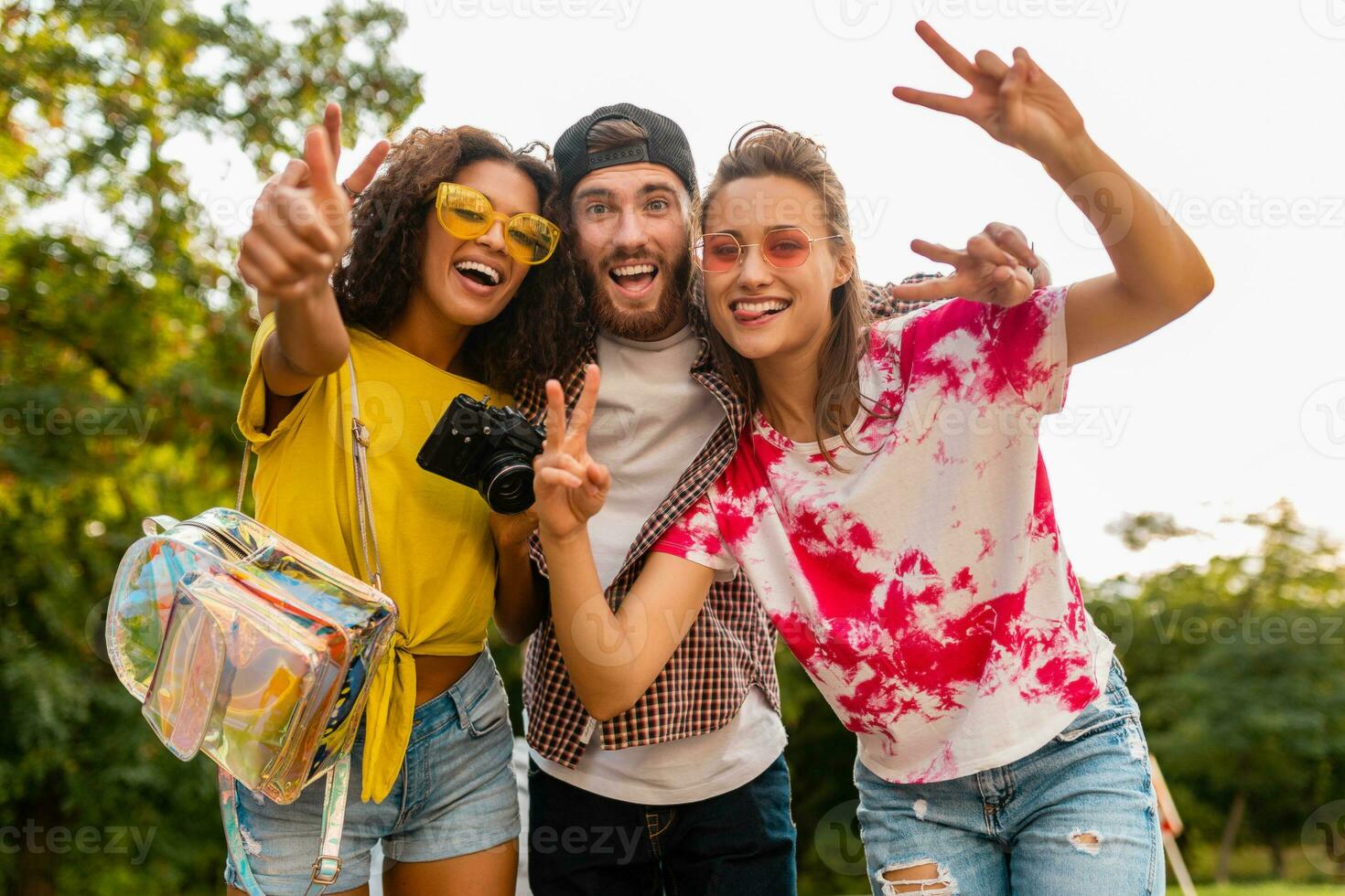 happy young company of friends having fun in park photo