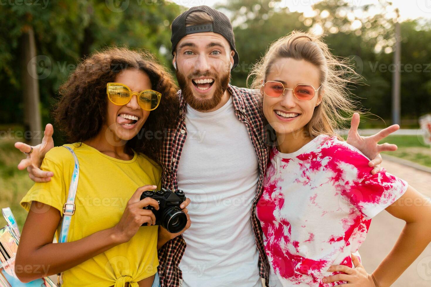 happy young company of friends having fun in park photo