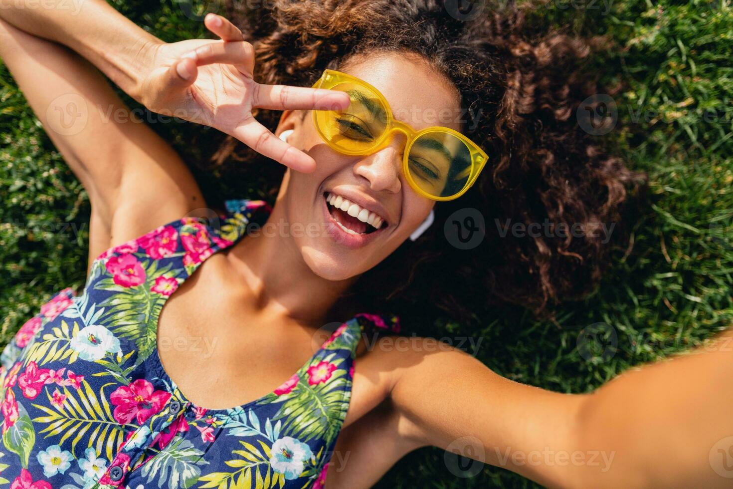 young stylish black woman having fun in park summer fashion style photo