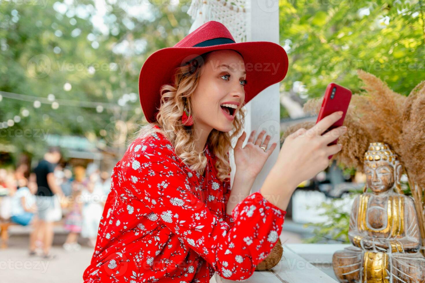 attractive stylish blond smiling woman in straw red hat and blouse summer fashion photo