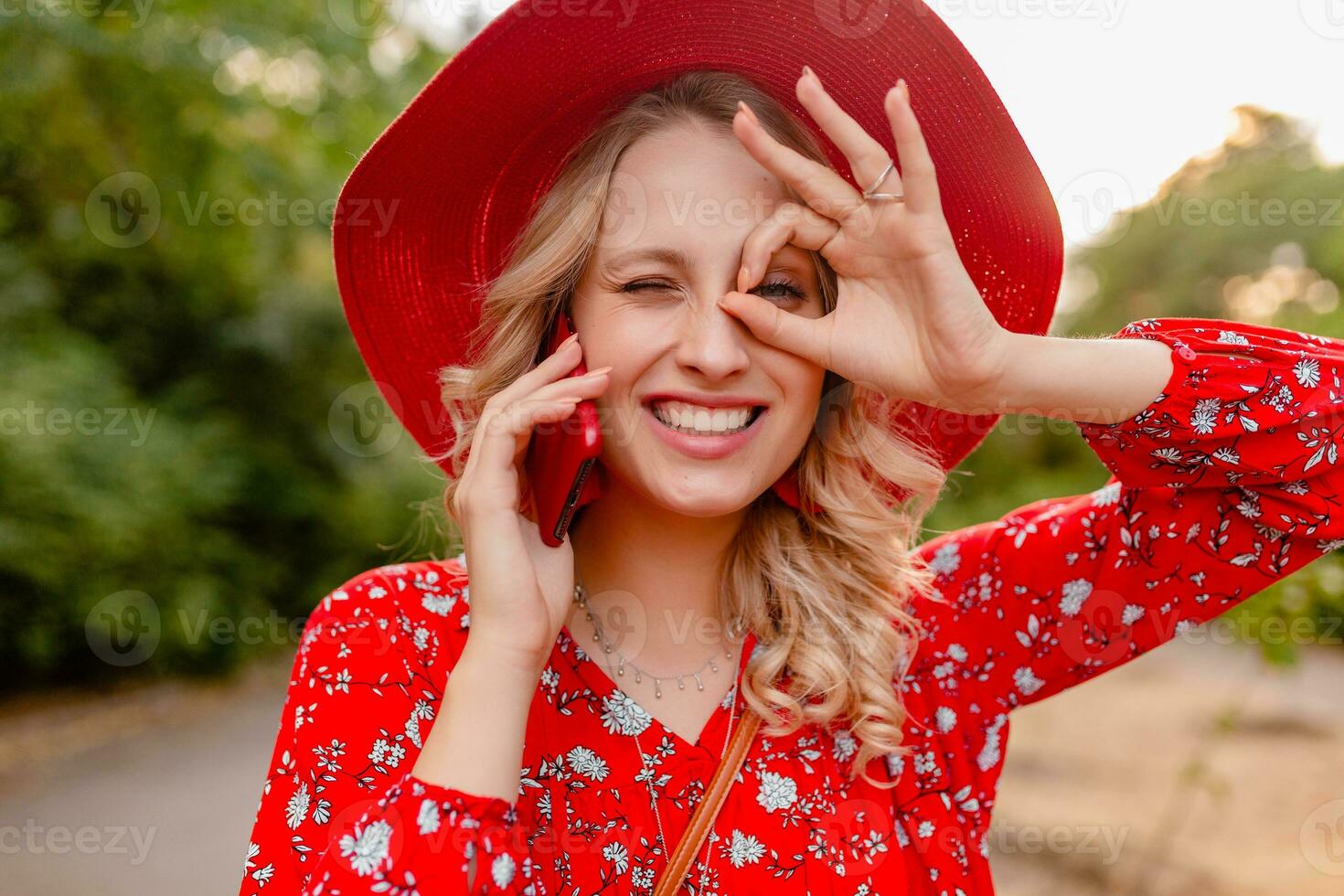 attractive stylish blond smiling woman in straw red hat and blouse summer fashion photo