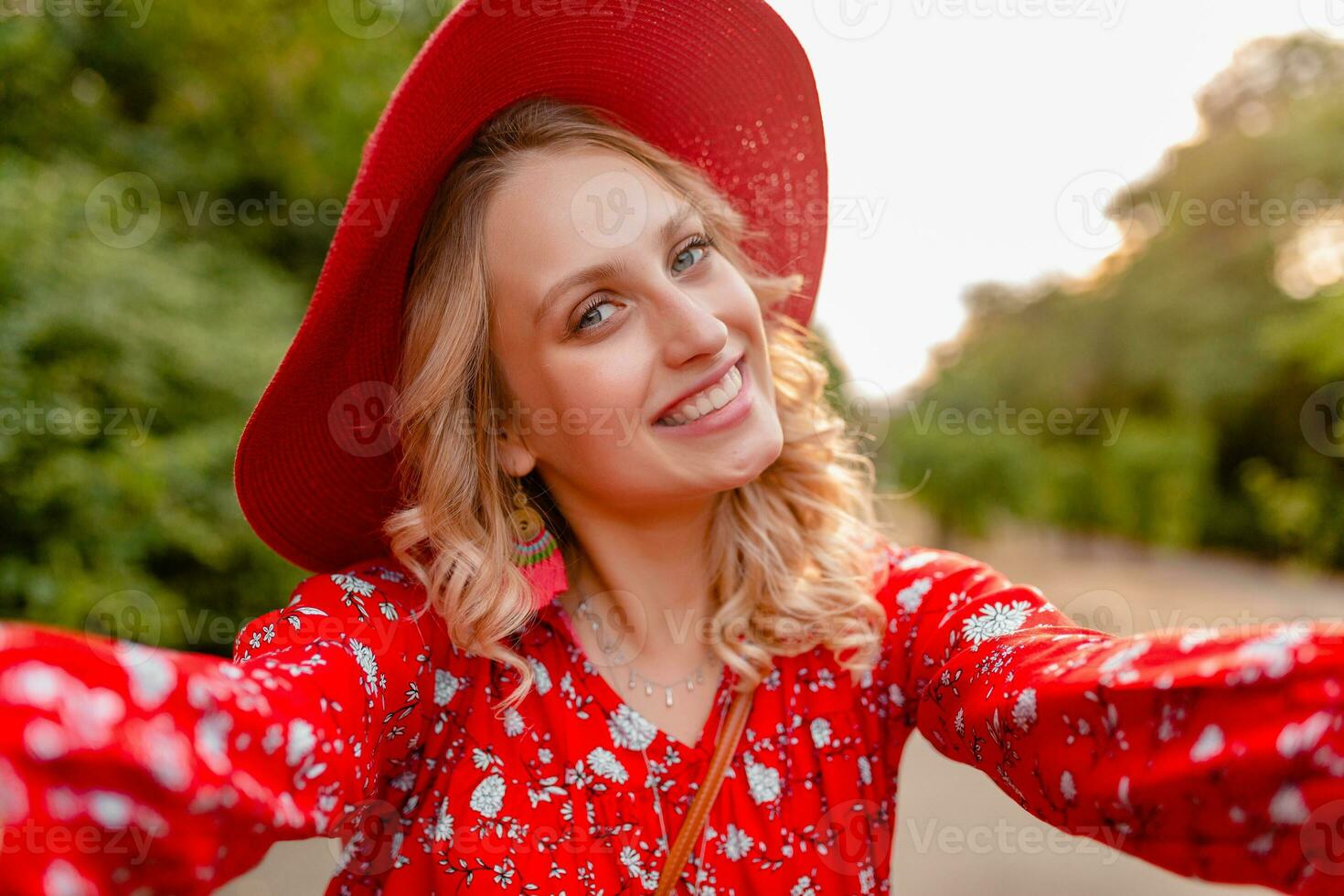 attractive stylish blond smiling woman in straw red hat and blouse summer fashion photo