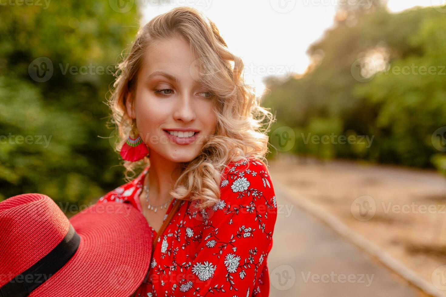 attractive stylish blond smiling woman in straw red hat and blouse summer fashion photo