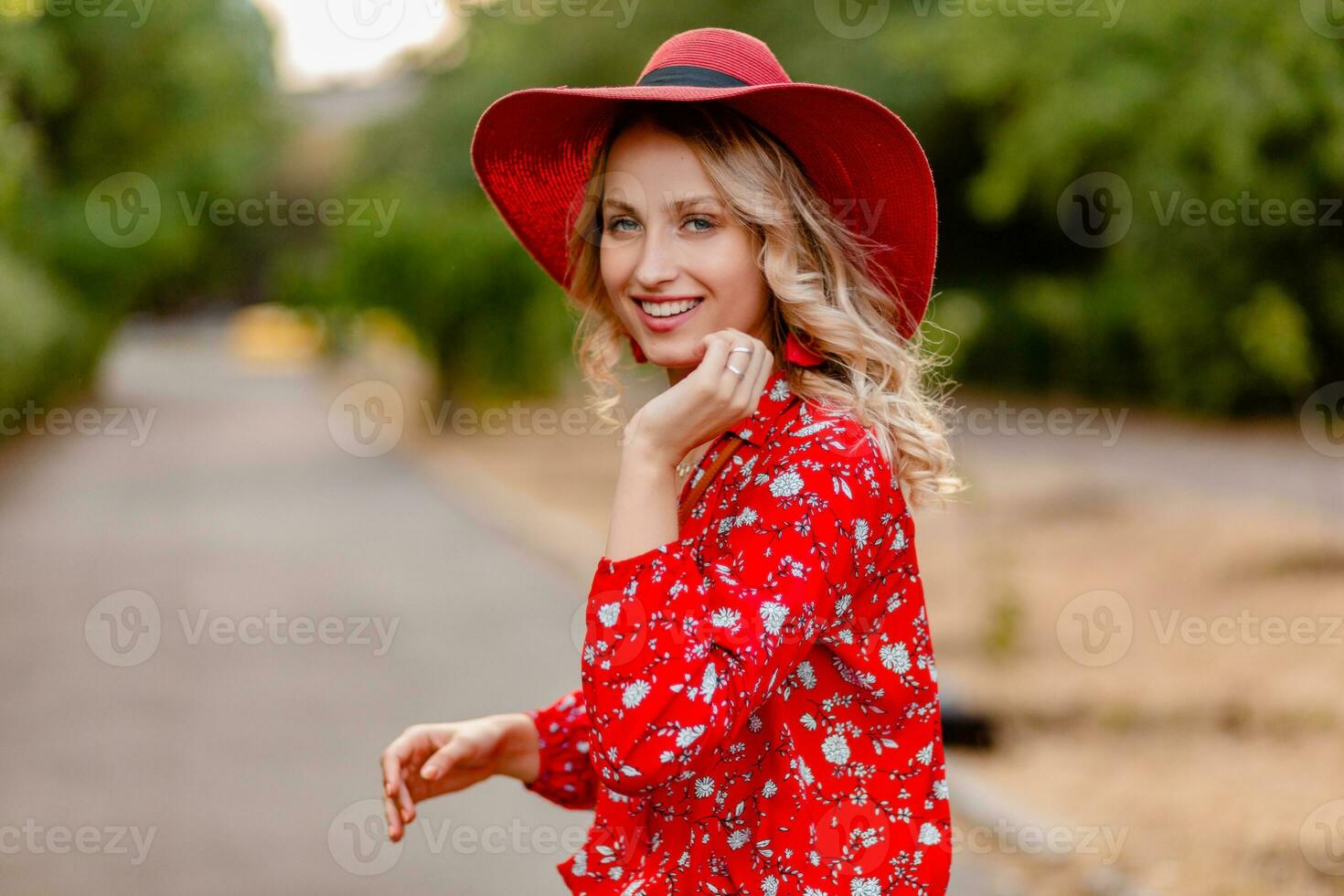 attractive stylish blond smiling woman in straw red hat and blouse summer fashion photo