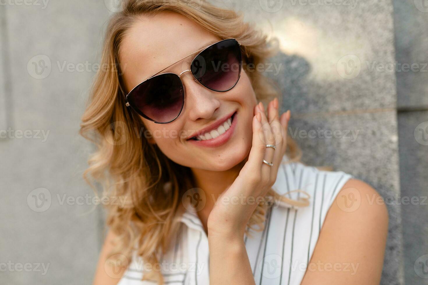 portrait of young attractive stylish woman smiling photo