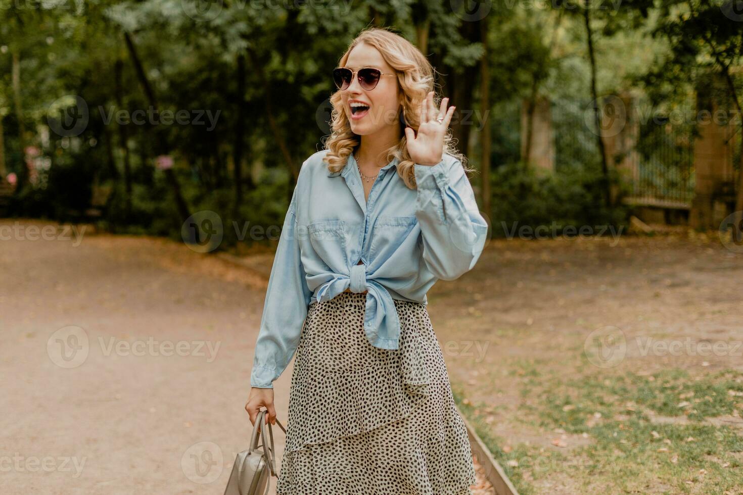 attractive woman walking in street photo