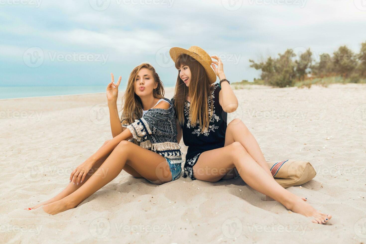stylish beautiful women on summer vacation on tropical beach photo
