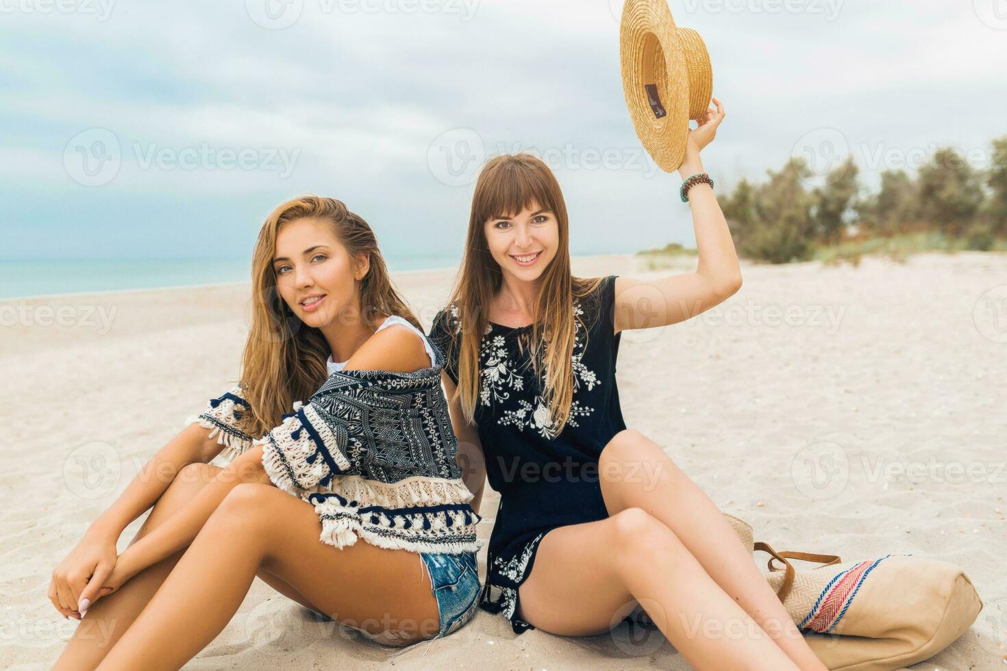 stylish beautiful women on summer vacation on tropical beach photo