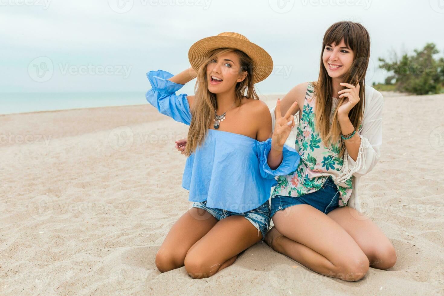 stylish beautiful women on summer vacation on tropical beach photo