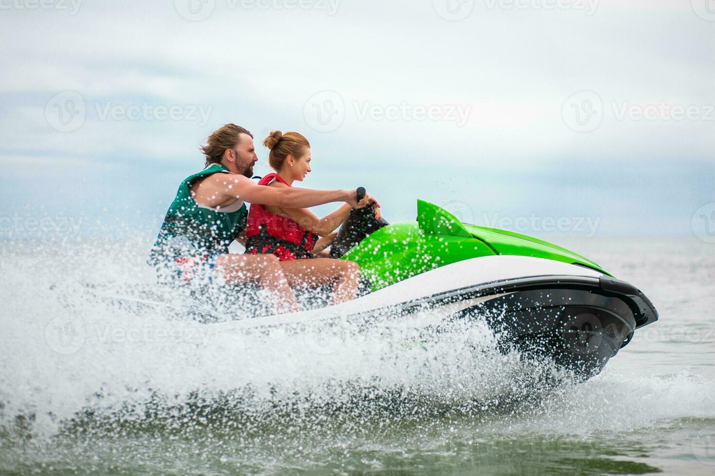 couple having fun on water scooter summer sea activity photo