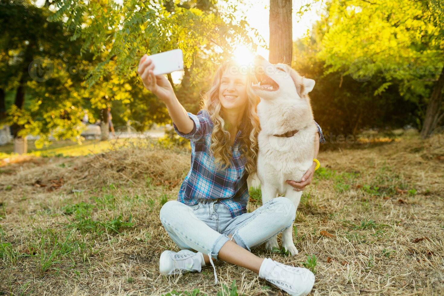 woman taking selfie photo with dog