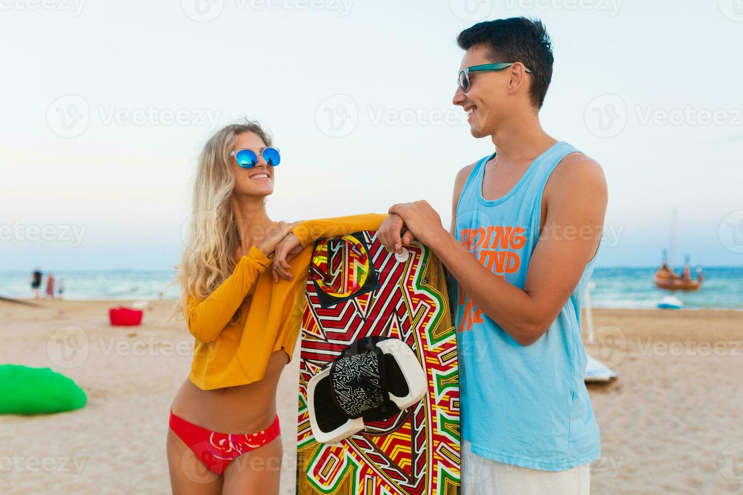 young couple having fun on beach photo