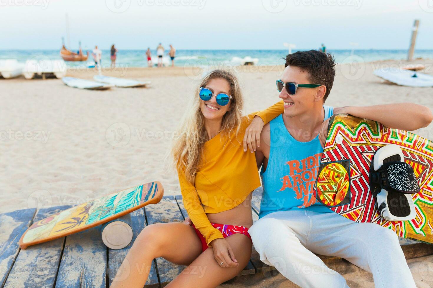 young couple having fun on beach photo