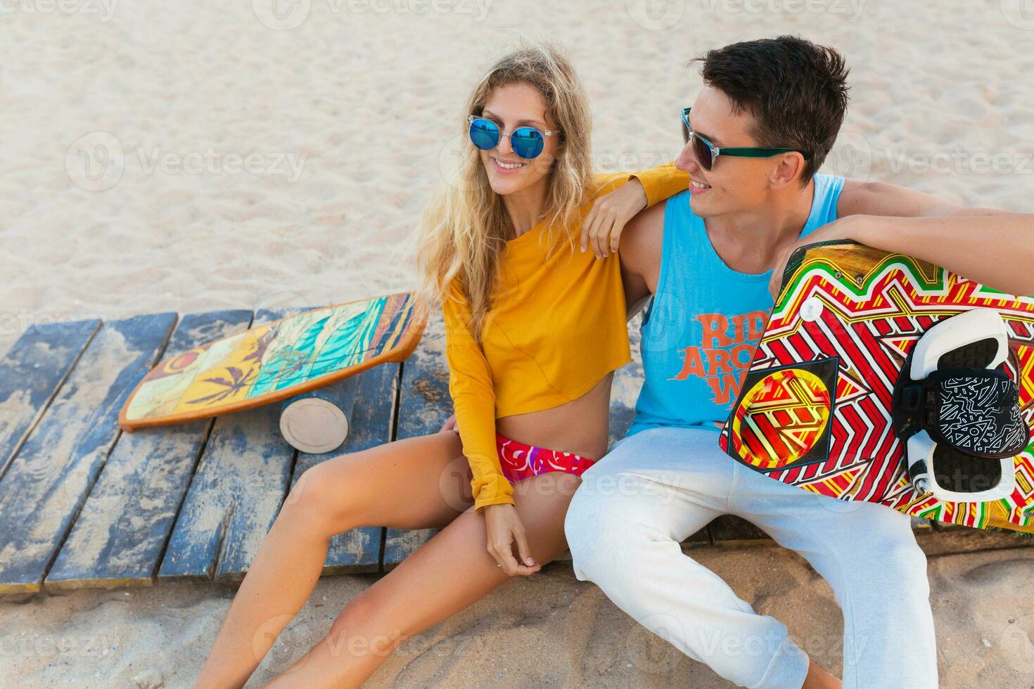 young couple having fun on beach photo