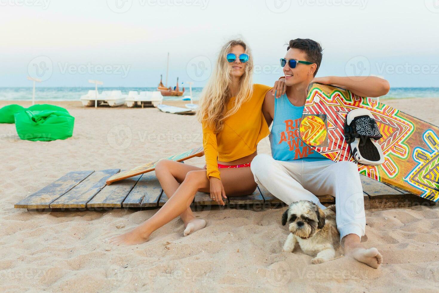 young couple having fun on beach photo