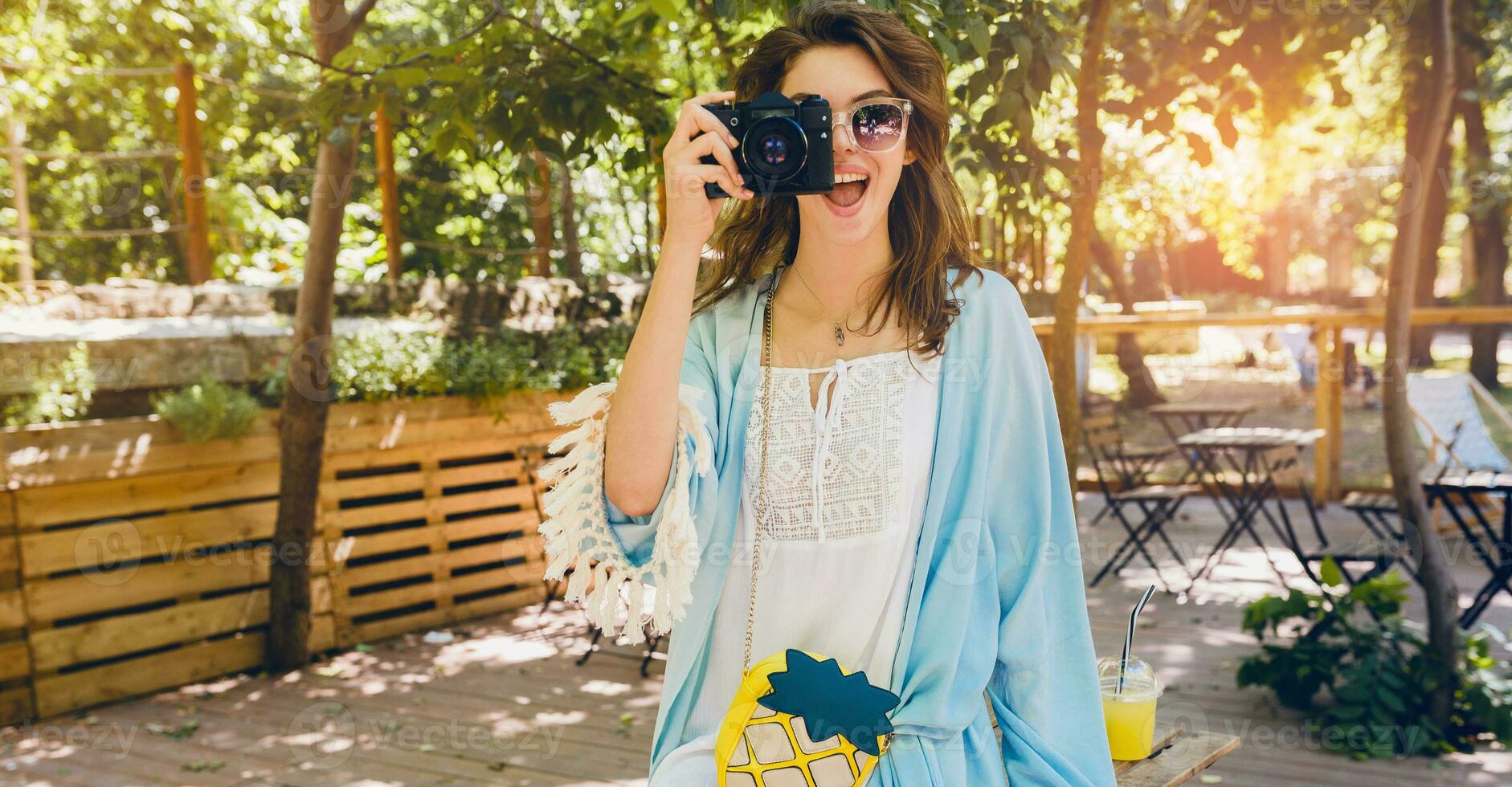 young attractive stylish woman in park photo