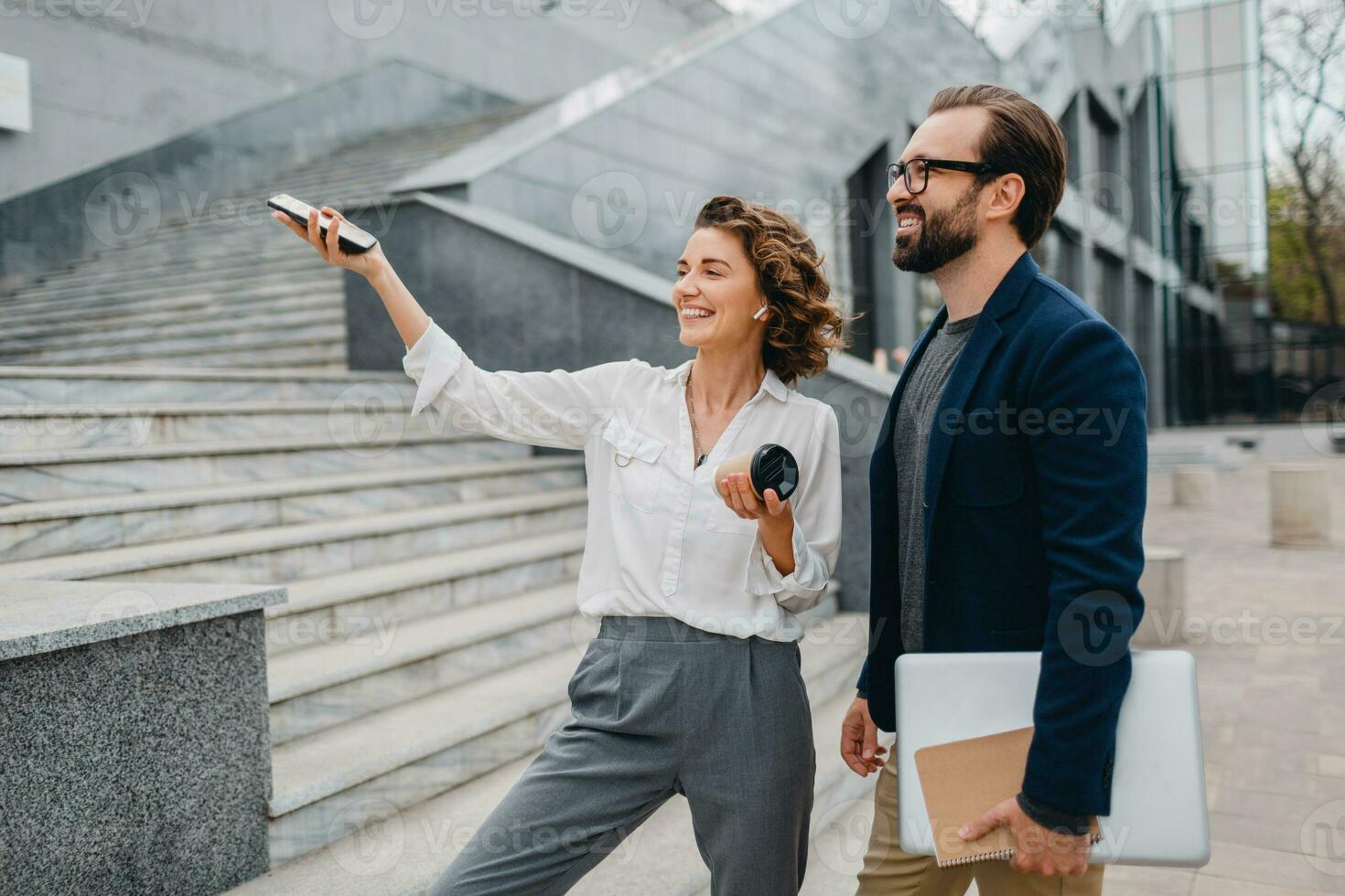 man and woman business partners working together photo