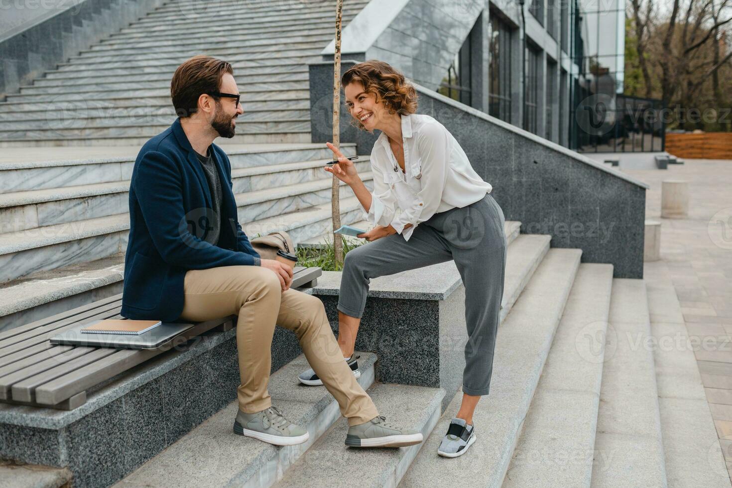 man and woman business partners working together photo