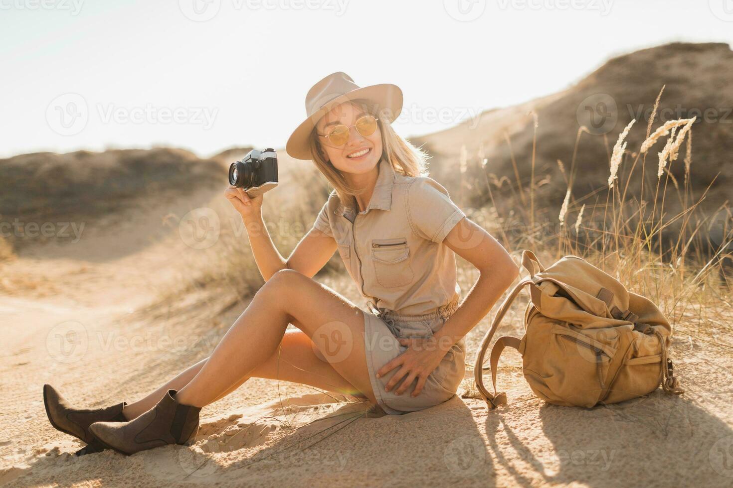 woman in desert walking on safari photo