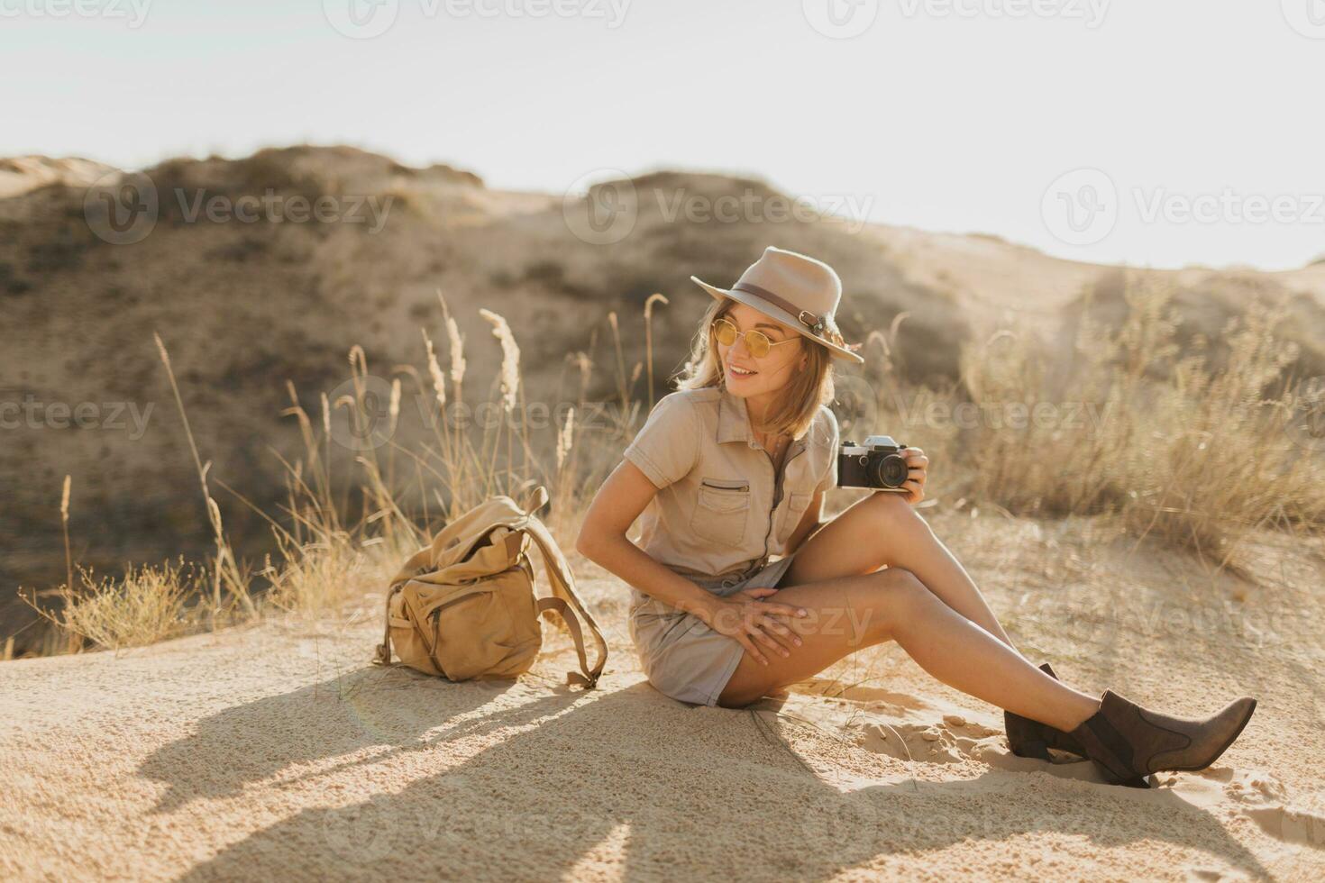 woman in desert walking on safari photo