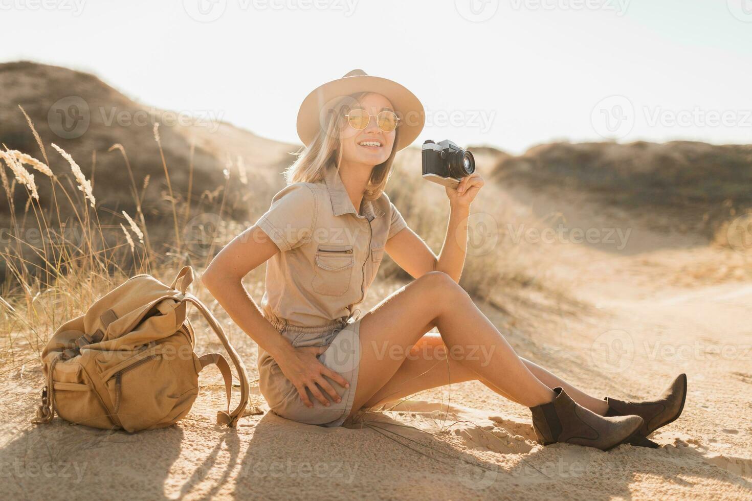 woman in desert walking on safari photo
